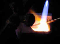 melting bronze rod with a torch